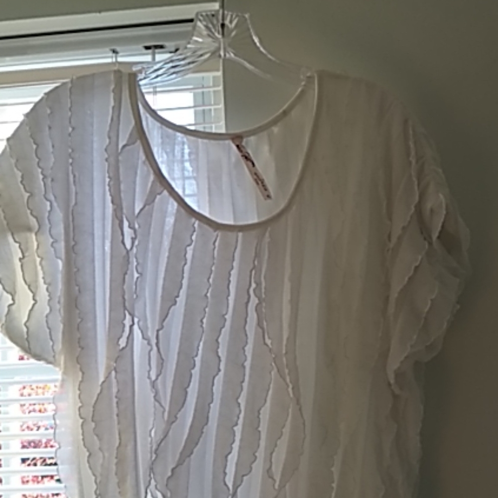 Andrea‎ white ruffle blouse with cap sleeves.